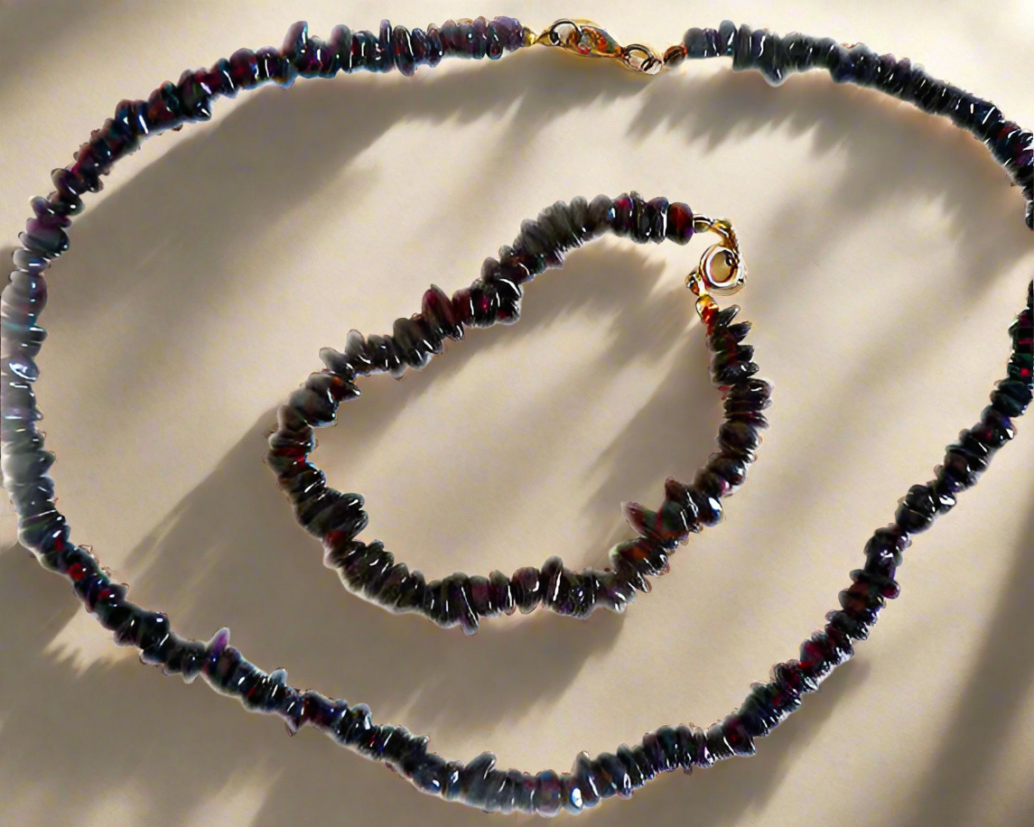 Parure avec collier et bracelet grenats polis
