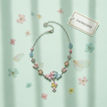 collier en émail rose et bleu avec fleurs et papillons nacrelune.com collier