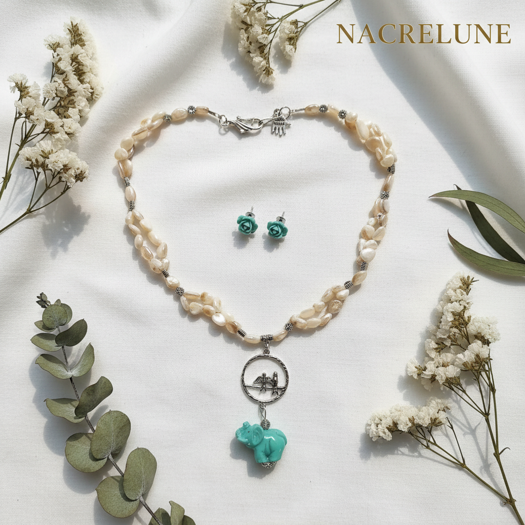 Parure en nacre avec éléphant en résine nacrelune.com parure
