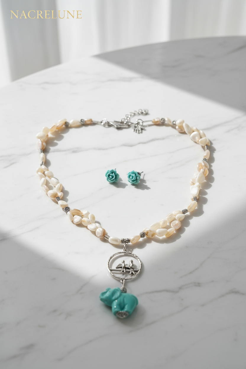 Parure en nacre avec éléphant en résine nacrelune.com parure