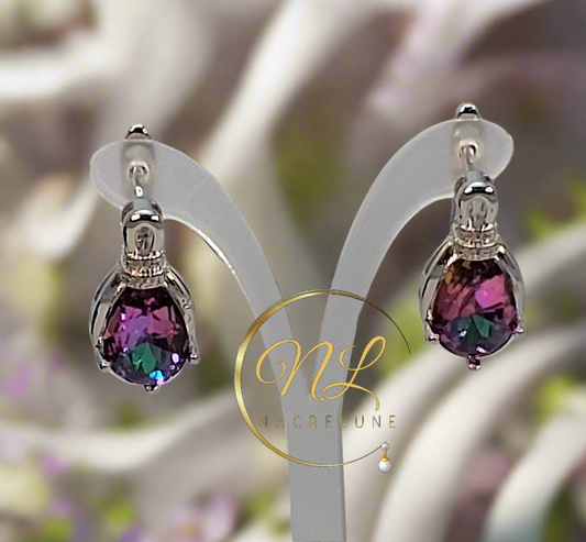 Boucles d’oreille en argent avec topazes taillées traitées