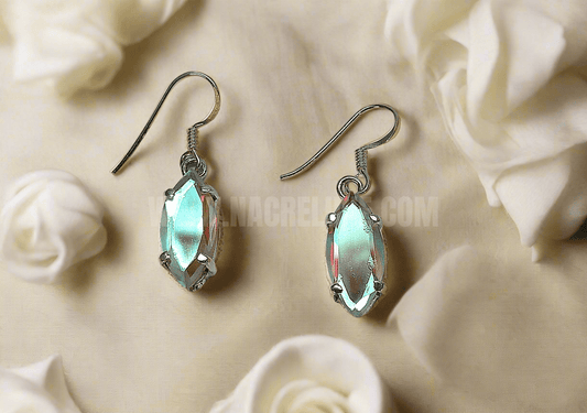 Boucles d’oreille en argent avec topazes traitées mystiques claires