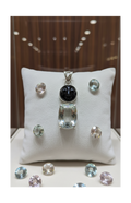 Genuine silver pendant with a mystically treated cut topaz and a carved sunstone