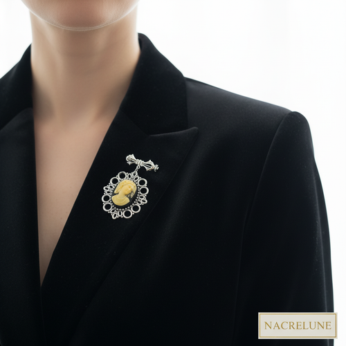 Woman wearing cameo brooch - white background