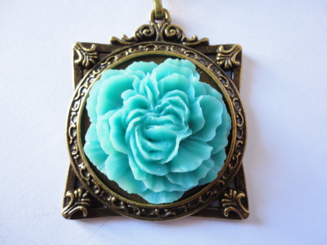 Pendentif cadre avec fleur (turquoise)